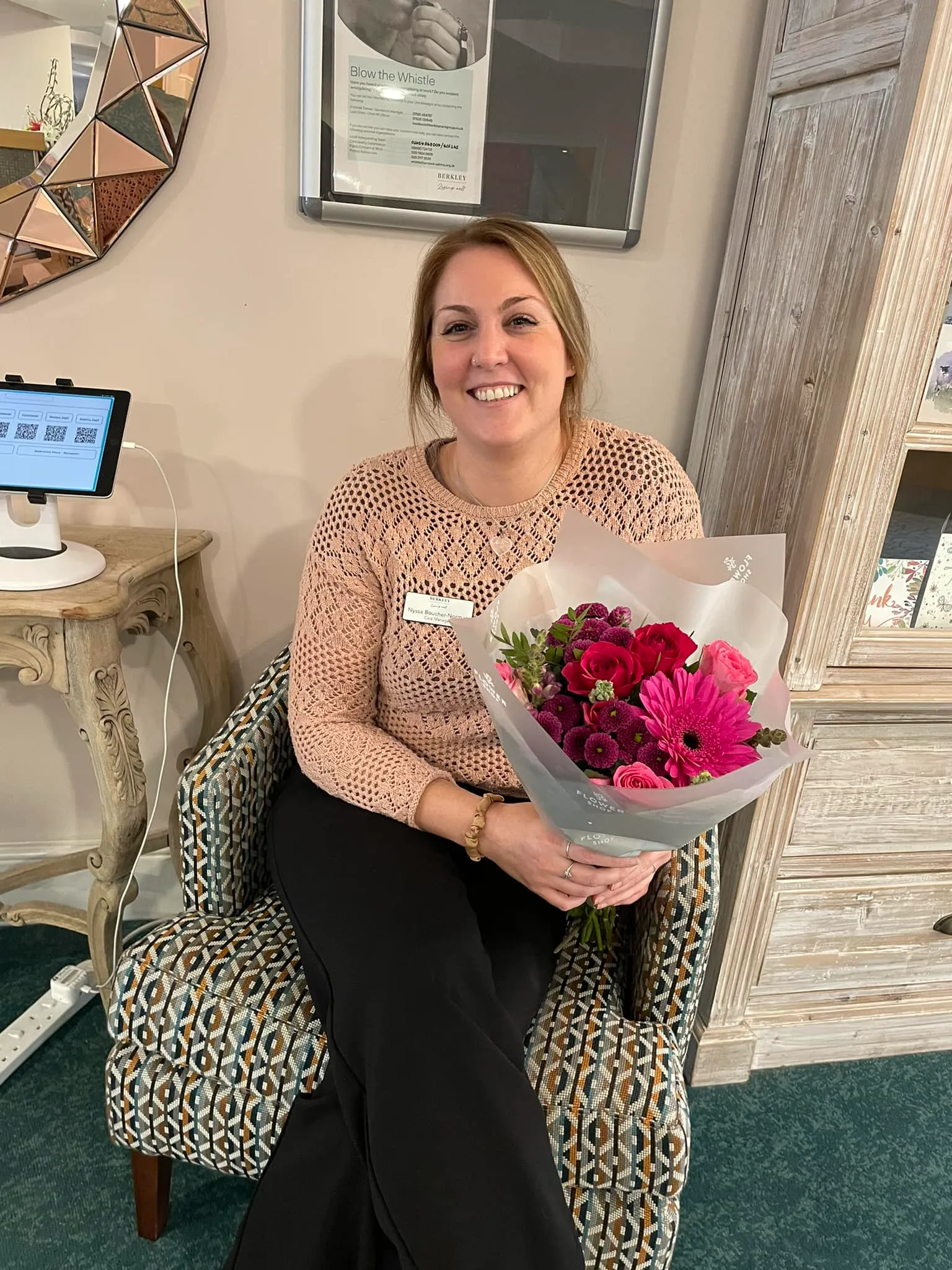 Lady in care home holding red roses